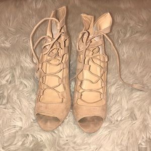 Nude strap up heels